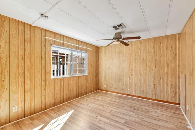 a view of a room with a window and a chandelier