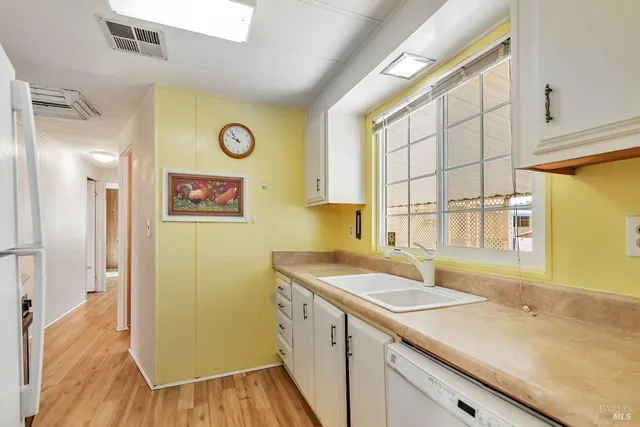 a utility room with a sink and a window