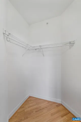 a view of a room with shelf on the wall