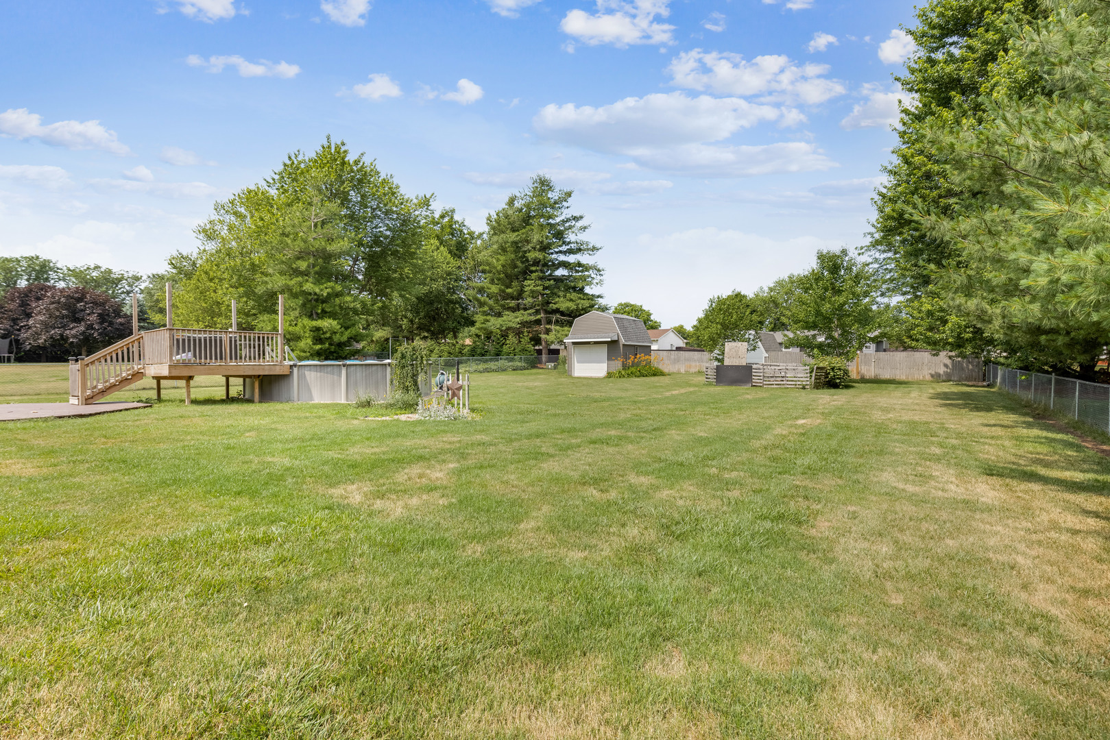 5394 South Mill Pond Road Rochelle, IL 61068 - Photo 28 of 28 a view of a garden with a house in the background