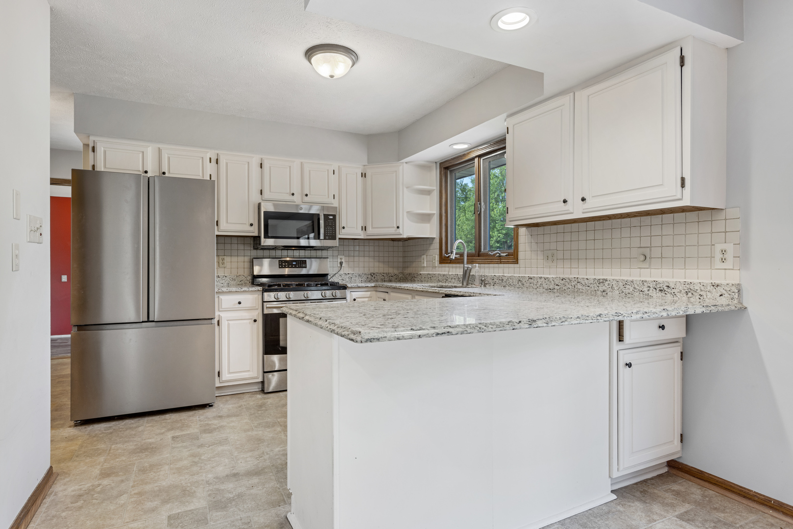 5394 South Mill Pond Road Rochelle, IL 61068 - Photo 6 of 28 a kitchen with appliances a sink and a refrigerator