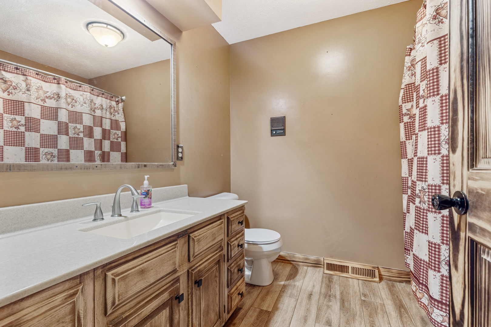 5394 South Mill Pond Road Rochelle, IL 61068 - Photo 9 of 28 a bathroom with a sink a toilet a mirror and shower