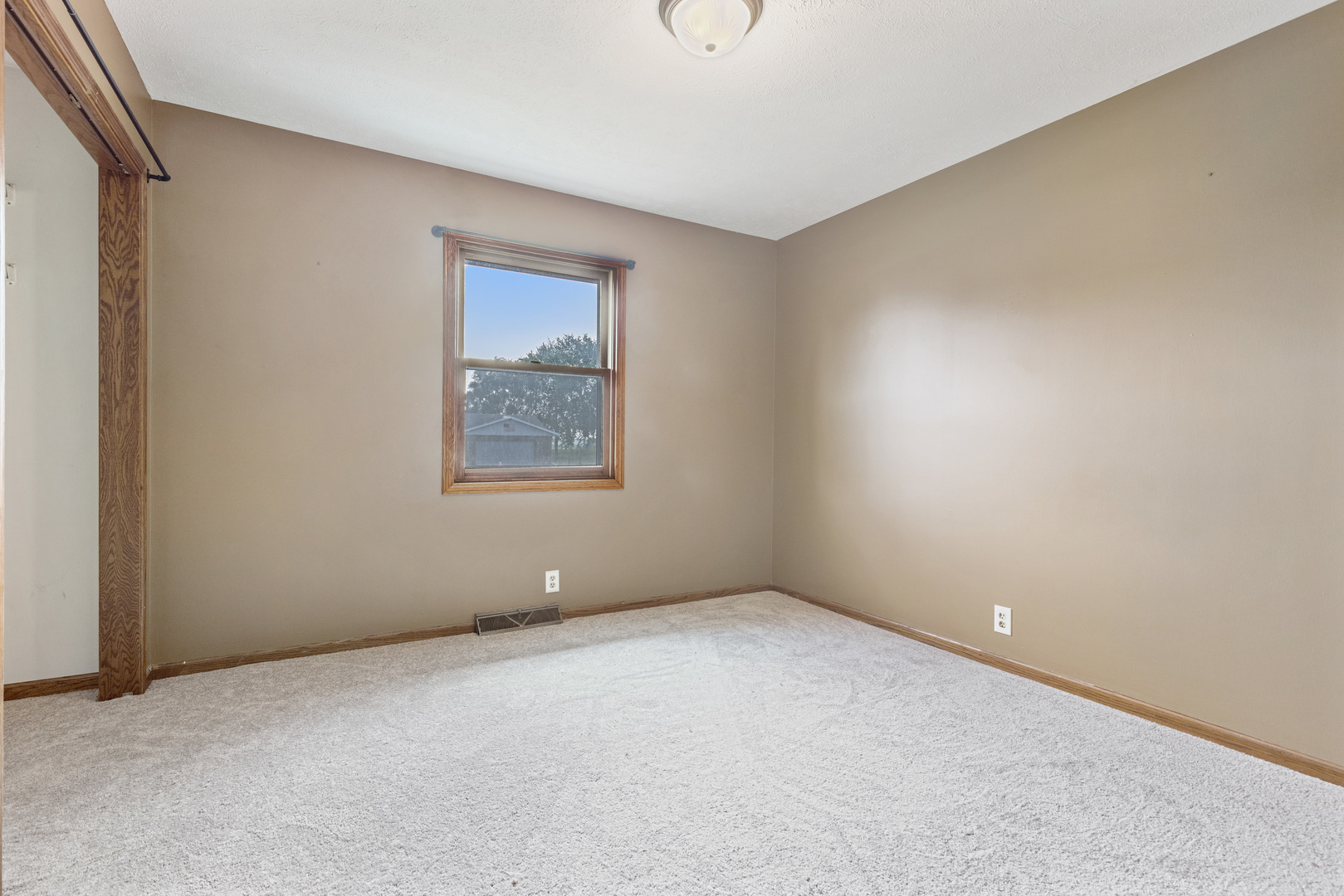 5394 South Mill Pond Road Rochelle, IL 61068 - Photo 10 of 28 a view of an empty room with a window