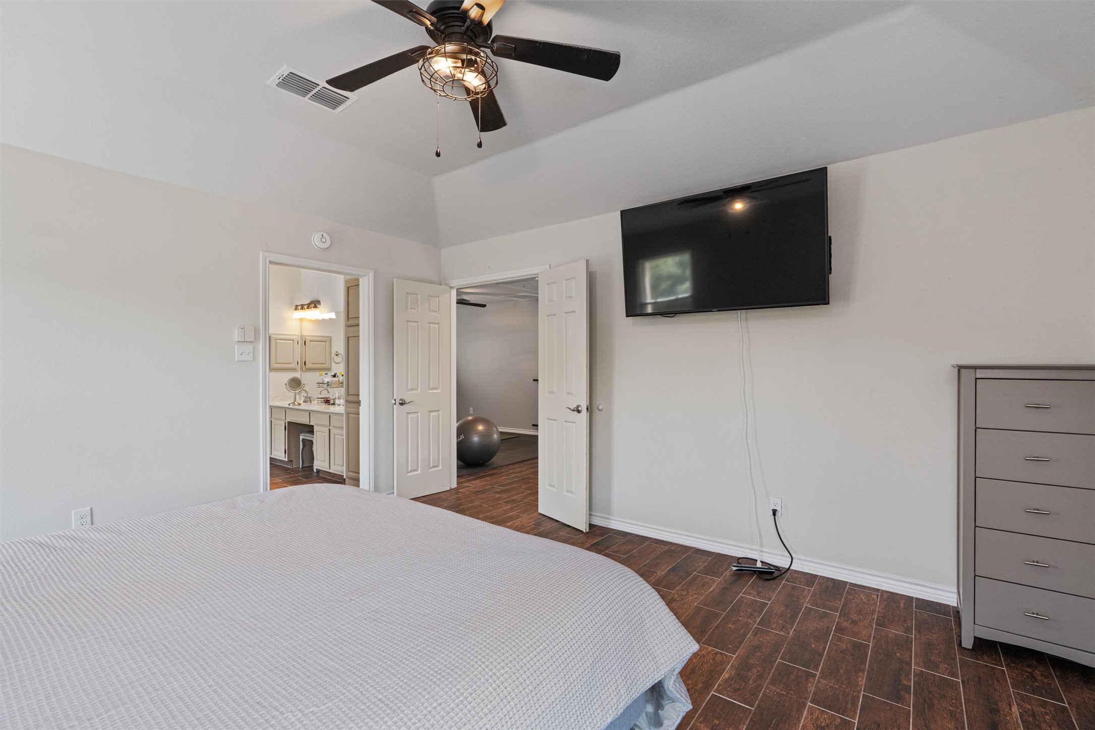 3011 Wadsworth Way Austin, TX 78748 - Photo 16 of 28 a bedroom with a bed and a flat screen tv