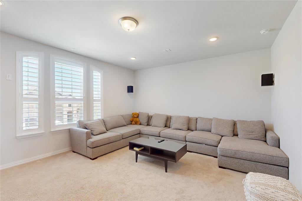 1997 Kieva Place Allen, TX 75013 - Photo 27 of 40 Living room with light carpet and recessed lighting