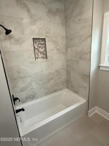 a bathroom with a bathtub