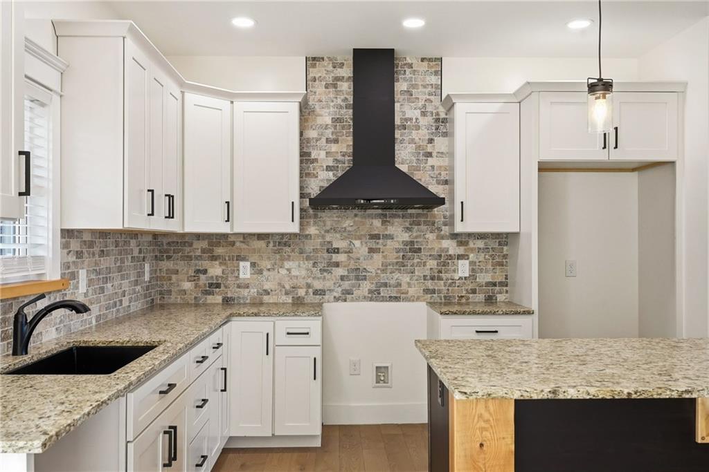 4844 Lucerne Road Indiana, PA 15701 - Photo 12 of 39 a kitchen with granite countertop a sink a stove and cabinets
