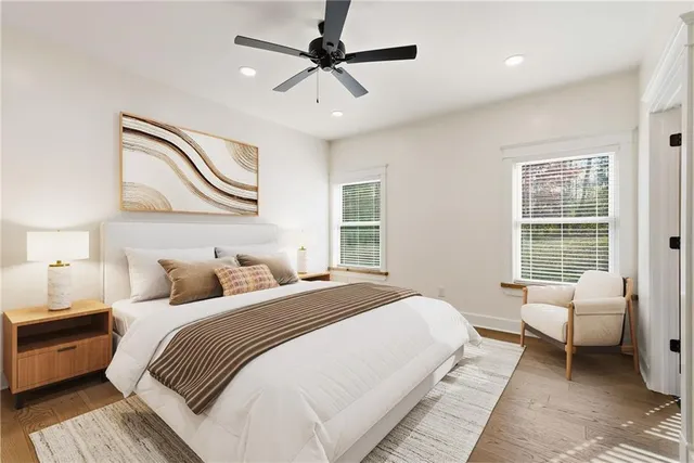 a bedroom with a bed couch and window