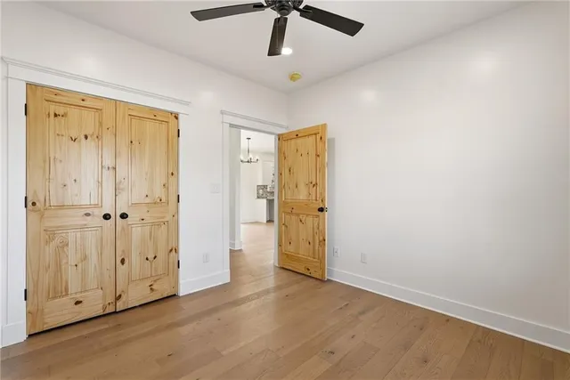 an empty room with wooden floor