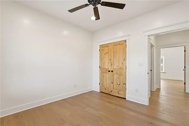 wooden floor in an empty room and a window