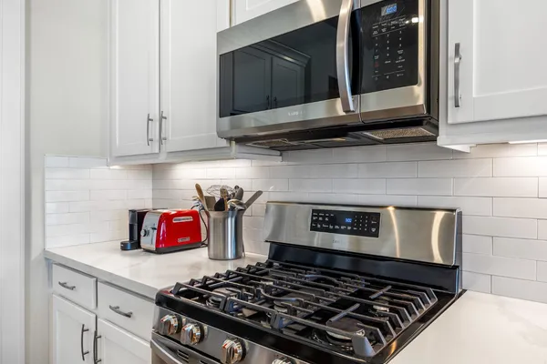 a kitchen with a sink cabinets and a window