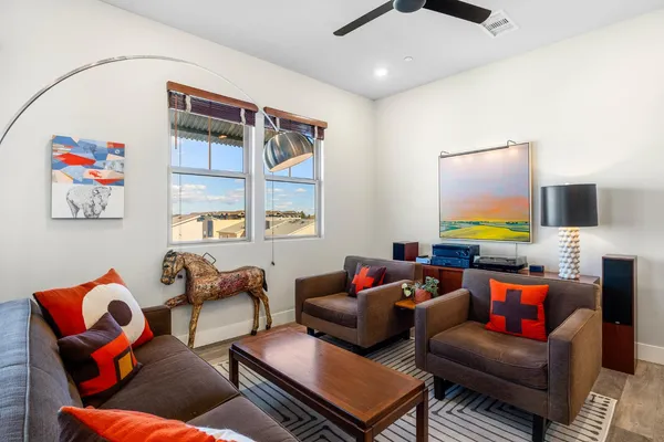 a view of a dining room with furniture window and wooden floor
