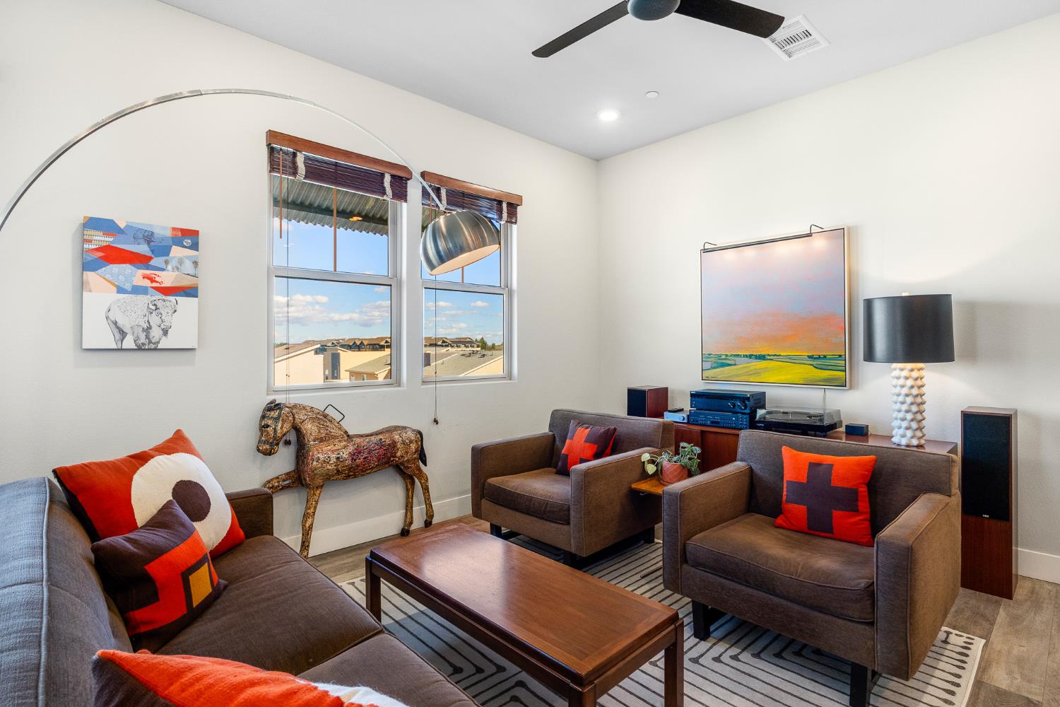 1661 Spring Street, Unit 433 Davis, CA 95616 - Photo 18 of 56 a living room with furniture a flat screen tv and a window