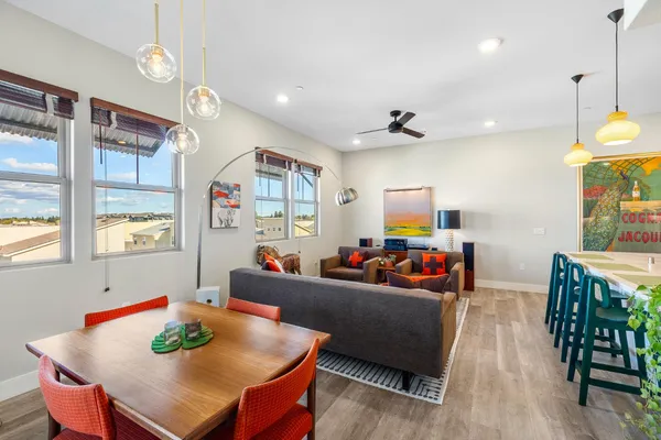 a blue couch sitting in front of a window