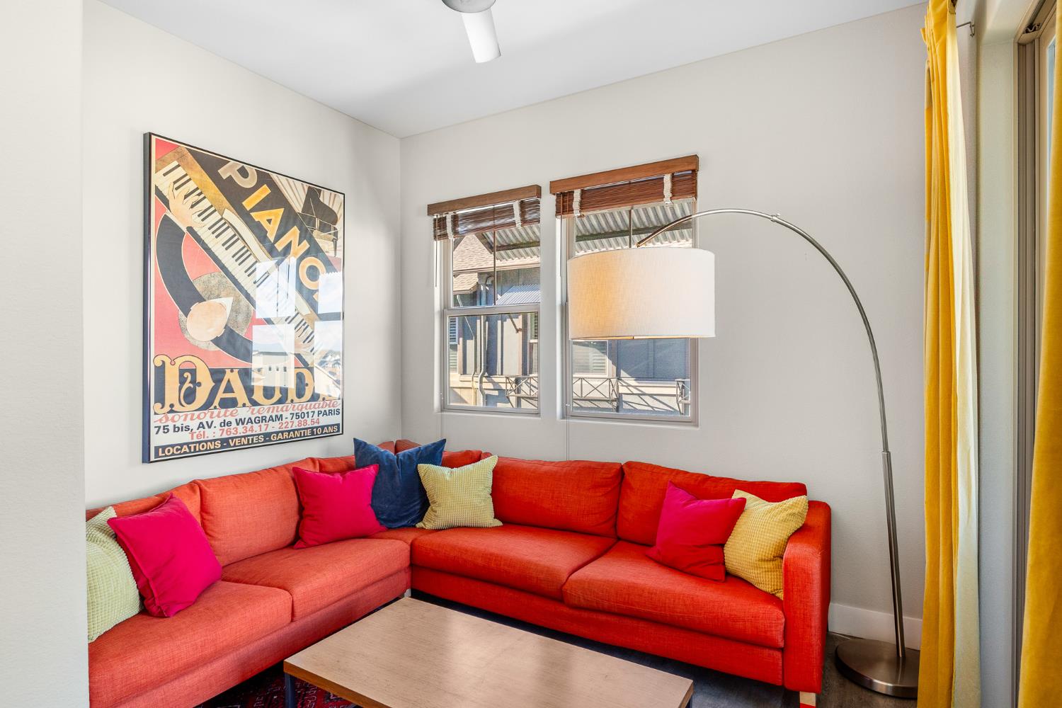 1661 Spring Street, Unit 433 Davis, CA 95616 - Photo 22 of 56 a blue couch sitting in a living room next to a window