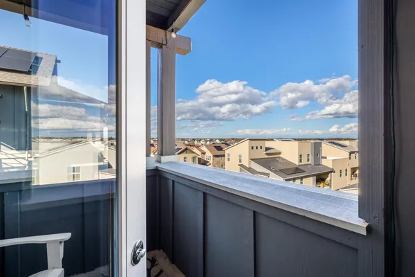 a bedroom with a bed and painting on the wall