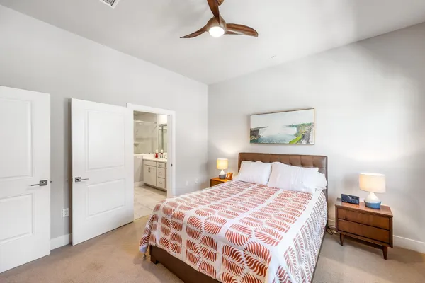 a bathroom with a double vanity sink mirror and shower