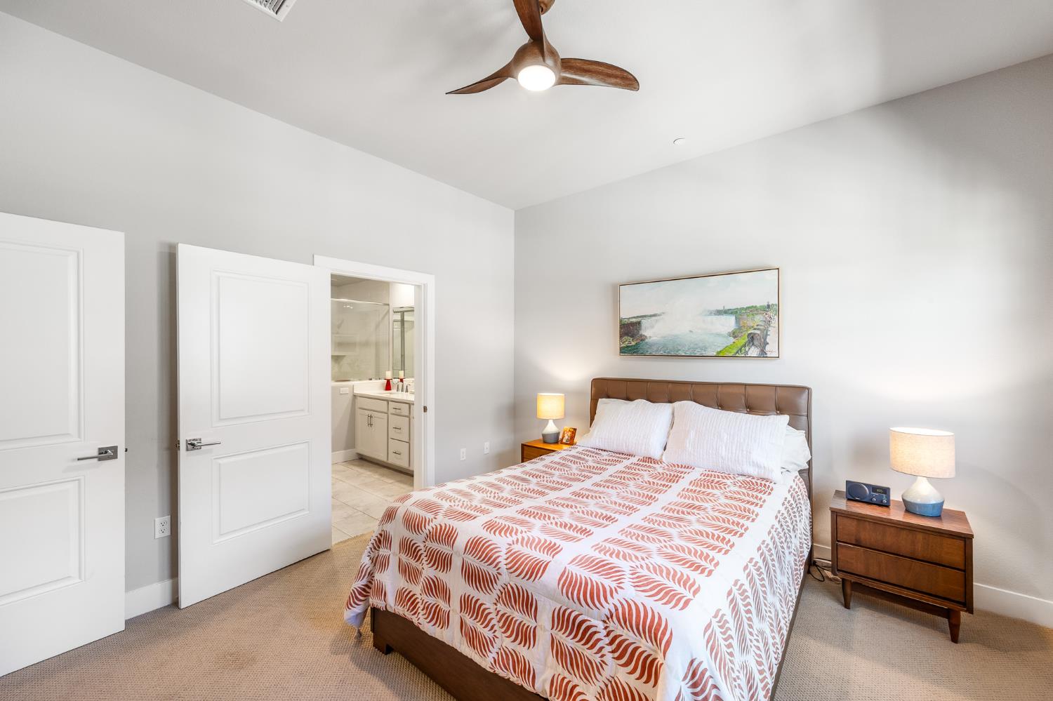 1661 Spring Street, Unit 433 Davis, CA 95616 - Photo 28 of 56 a bedroom with a bed and painting on the wall