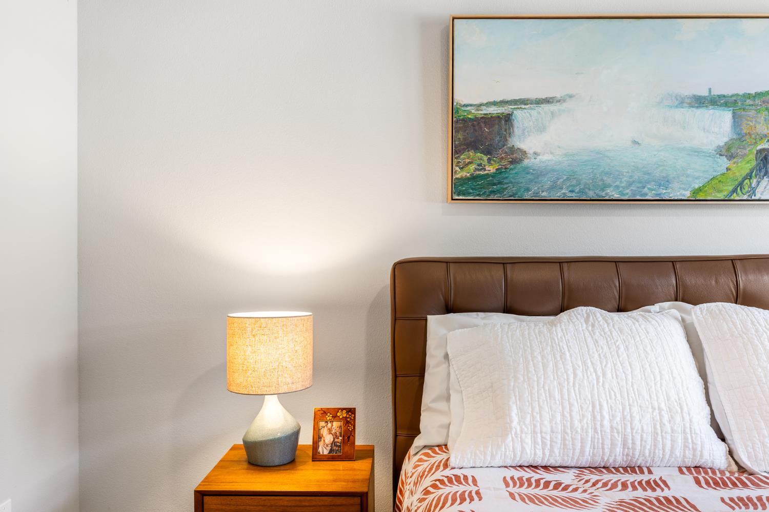 1661 Spring Street, Unit 433 Davis, CA 95616 - Photo 29 of 56 a bedroom with a bed and wall painting