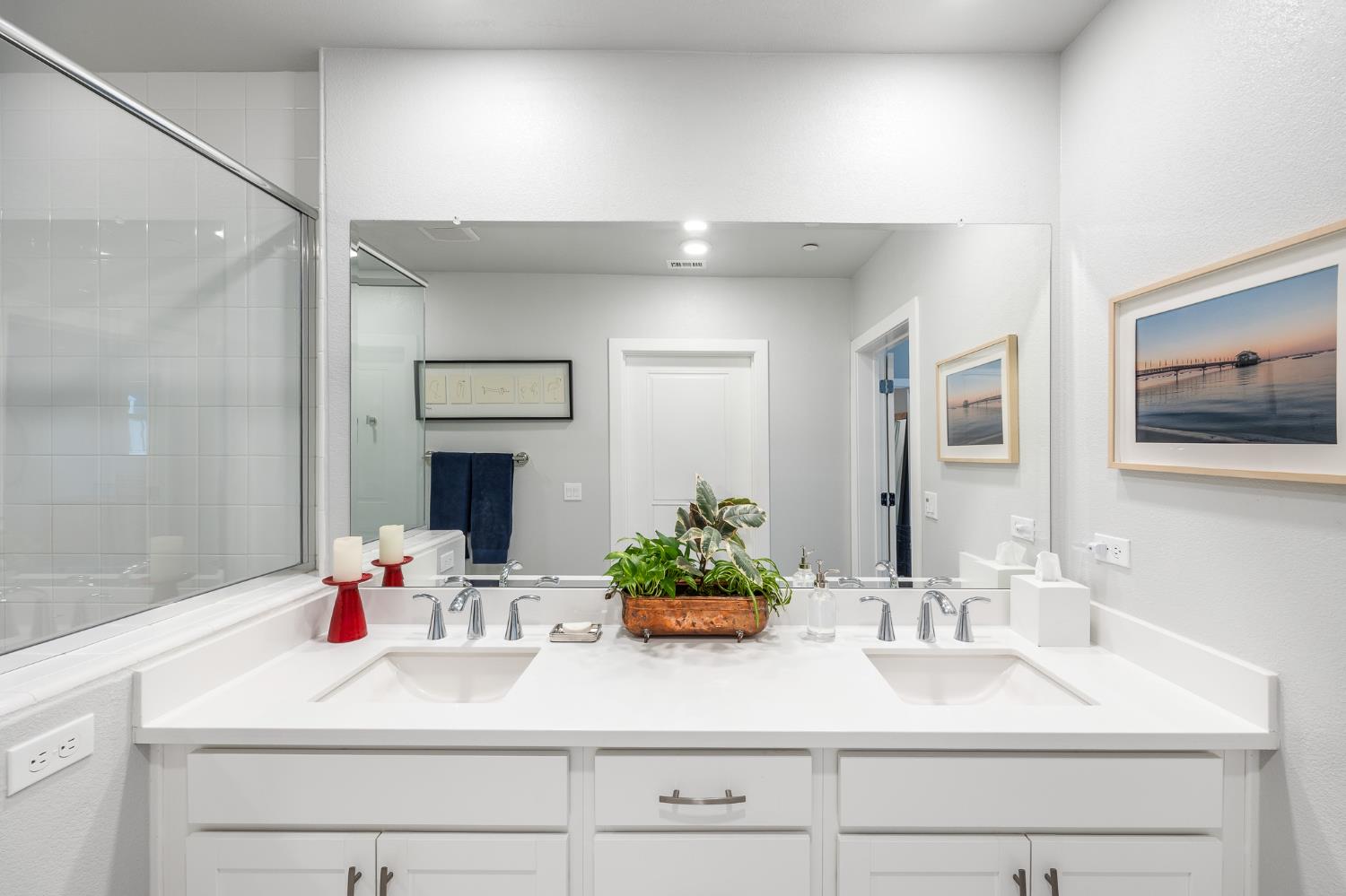 1661 Spring Street, Unit 433 Davis, CA 95616 - Photo 31 of 56 a bathroom with double vanity sink a mirror and a shower