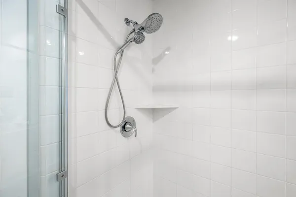 a en suite bathroom with a sink and a mirror