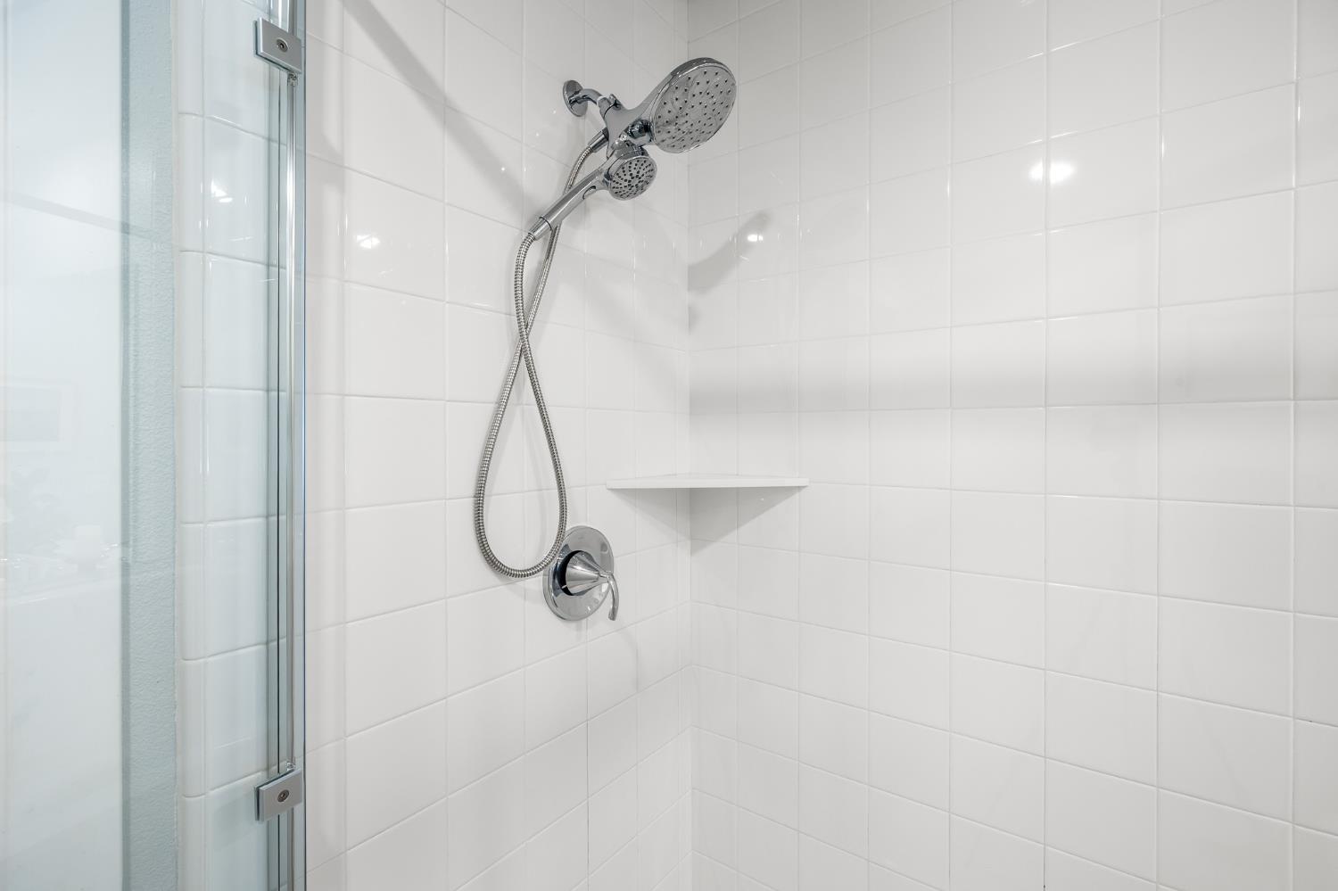 1661 Spring Street, Unit 433 Davis, CA 95616 - Photo 33 of 56 a bathroom with a glass shower door