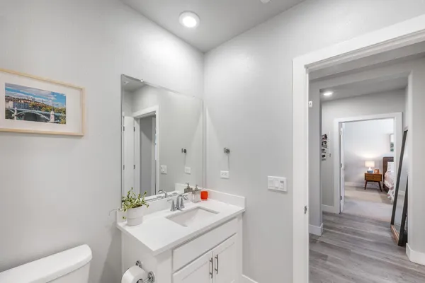 an aerial view of residential houses with outdoor space and mountain view in back