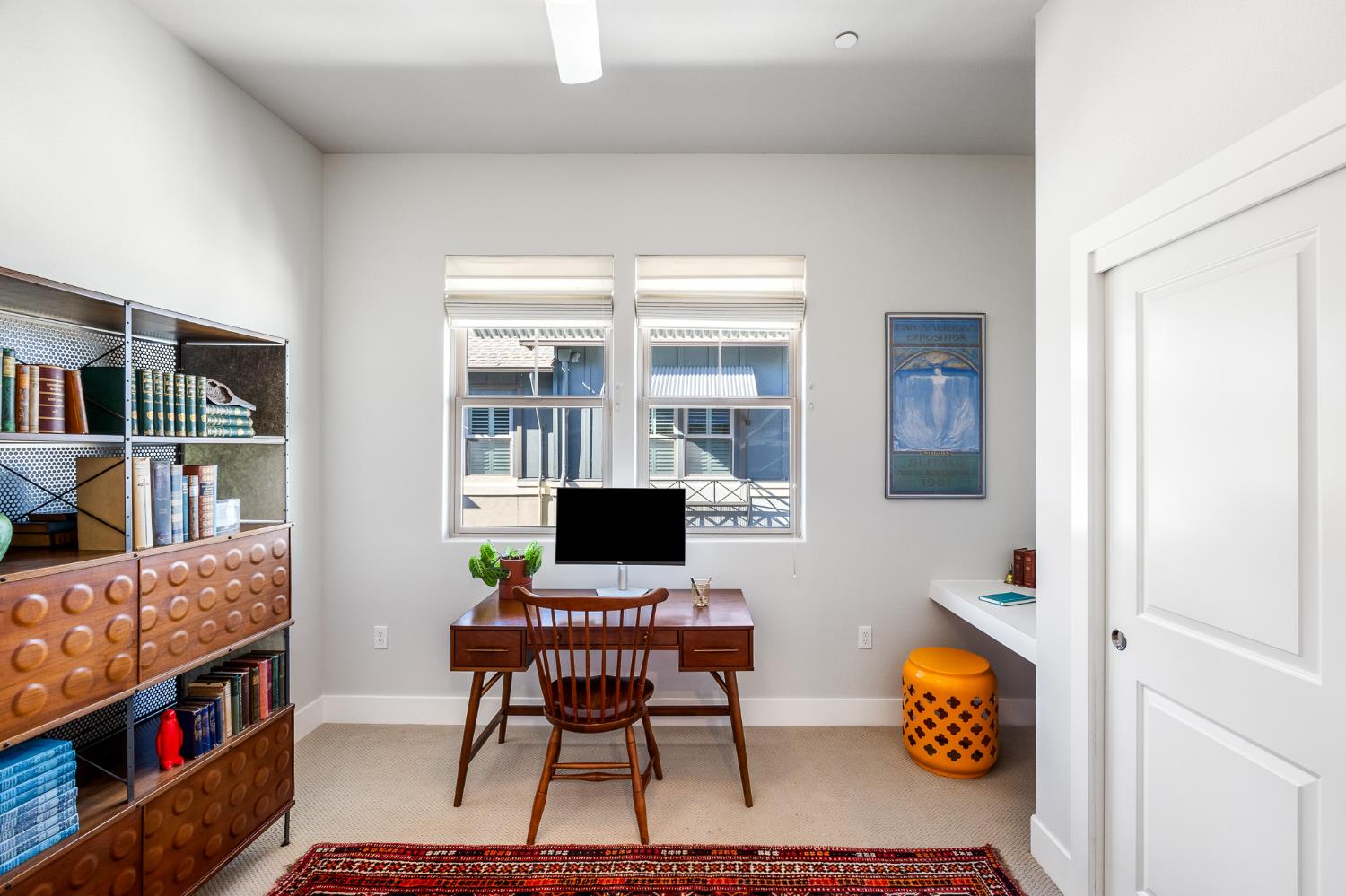 1661 Spring Street, Unit 433 Davis, CA 95616 - Photo 38 of 56 a workspace with furniture and book shelf