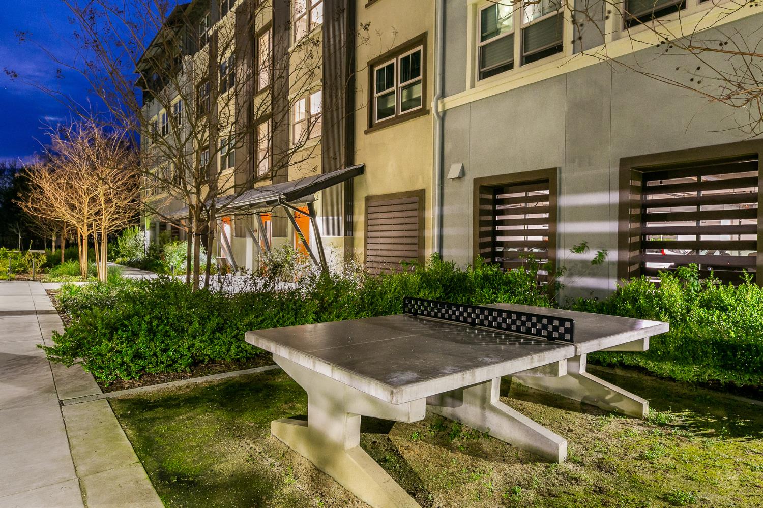 1661 Spring Street, Unit 433 Davis, CA 95616 - Photo 5 of 56 a view of a patio with a table and chairs and potted plants