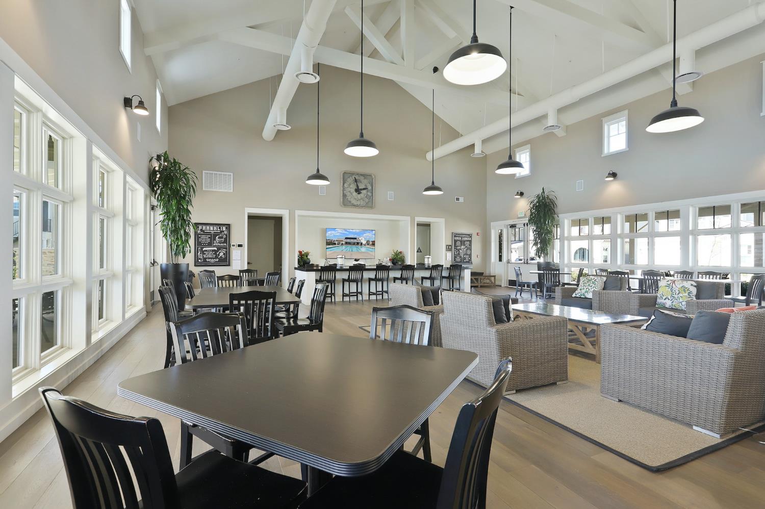 1661 Spring Street, Unit 433 Davis, CA 95616 - Photo 54 of 56 a view of a dining room with furniture and a chandelier