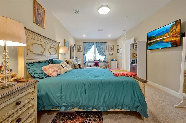 a bedroom with a bed and a cabinets