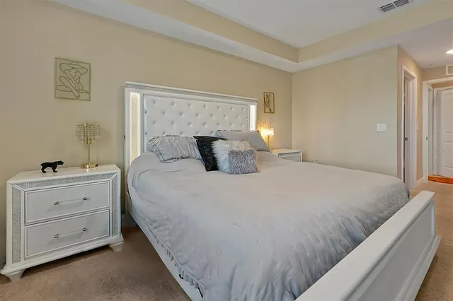 a bedroom with a bed and a dresser