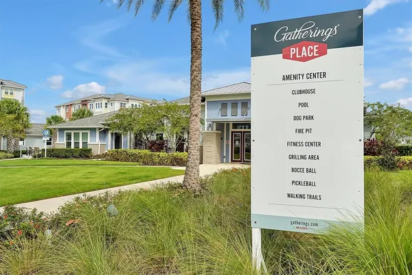 a front view of multiple houses with yard patio and swimming pool