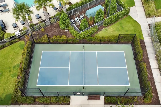 a living room with lots of furniture and a chandelier