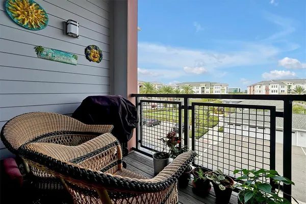 a view of roof deck with wooden fence