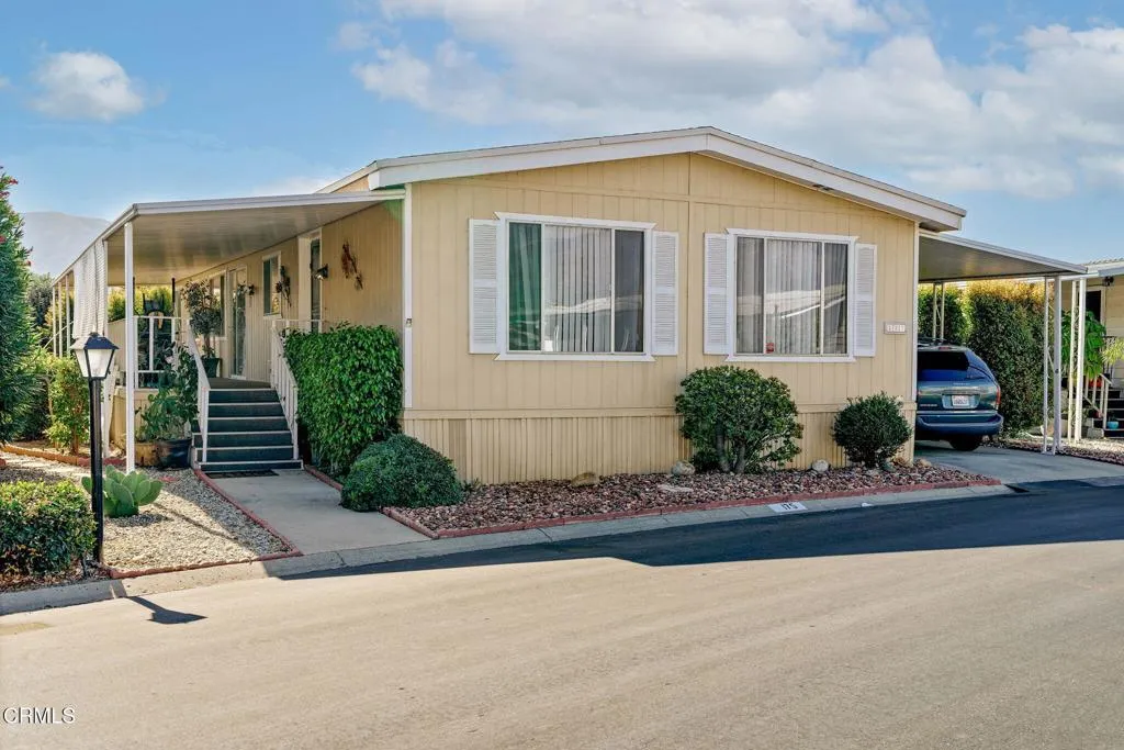 250 East Telegraph Road, Unit 175 Fillmore, CA 93015 - Photo 1 of 1 a front view of a house with a garden
