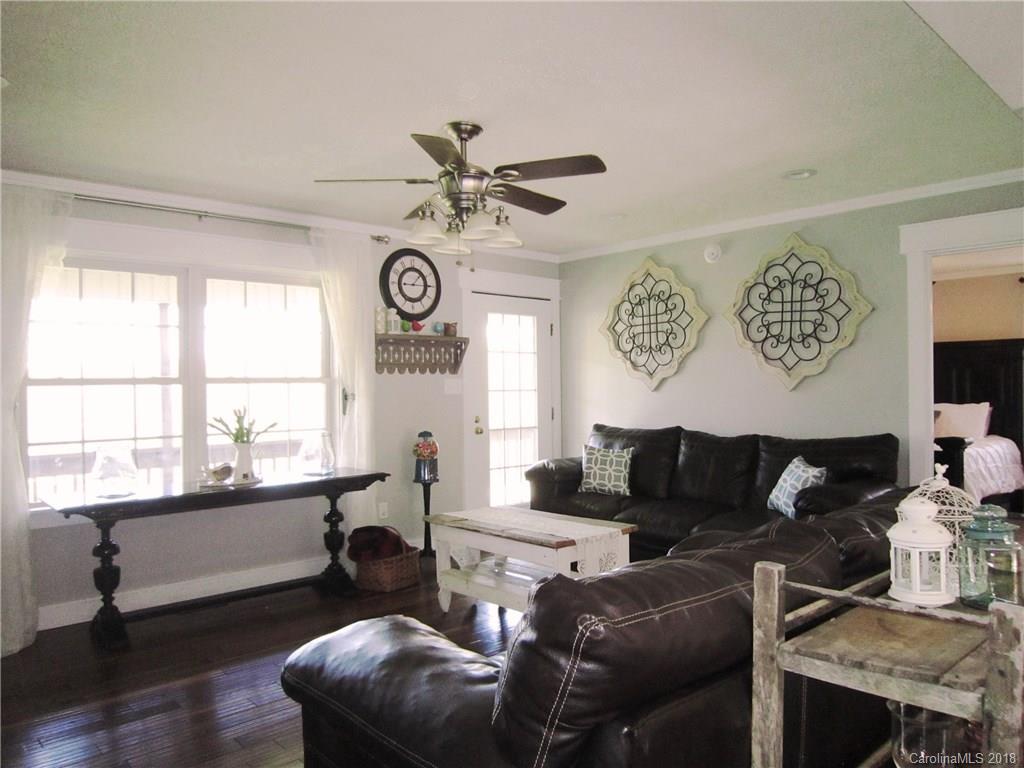 266 Murray Road Canton, NC 28716 - Photo 2 of 36 a living room with furniture and a large window
