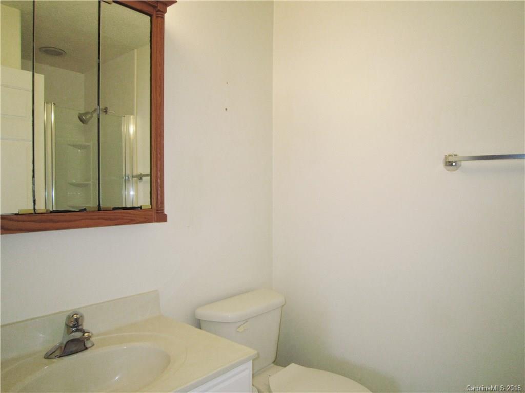 266 Murray Road Canton, NC 28716 - Photo 14 of 36 a bathroom with a sink mirror and toilet