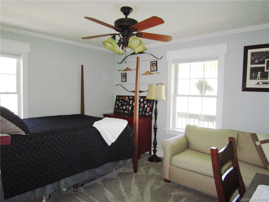 266 Murray Road Canton, NC 28716 - Photo 15 of 36 a living room with furniture a chandelier and a window