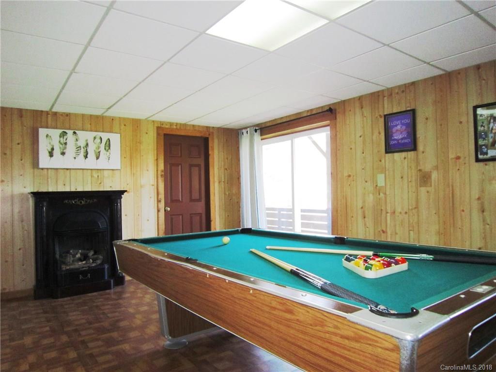 266 Murray Road Canton, NC 28716 - Photo 20 of 36 a room with pool table and a fireplace