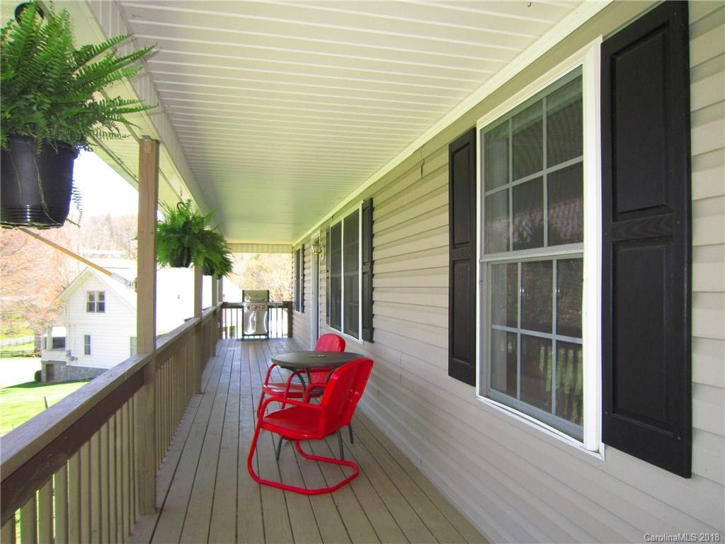 266 Murray Road Canton, NC 28716 - Photo 25 of 36 a balcony with furniture and wooden floor