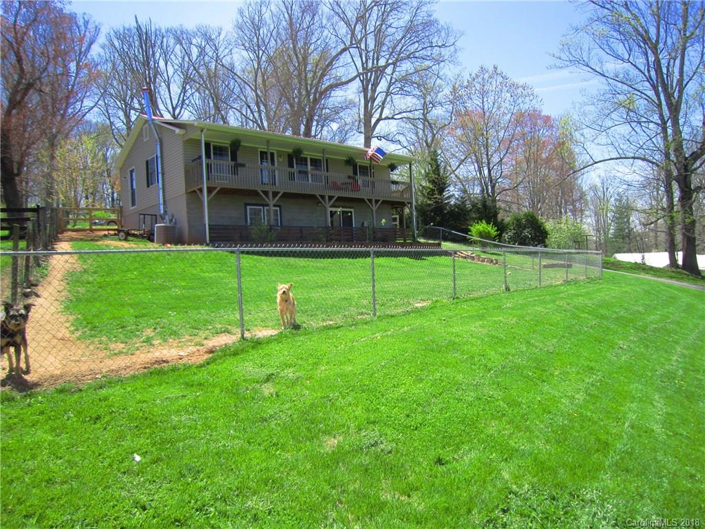 266 Murray Road Canton, NC 28716 - Photo 30 of 36 a view of a house with backyard and a tree