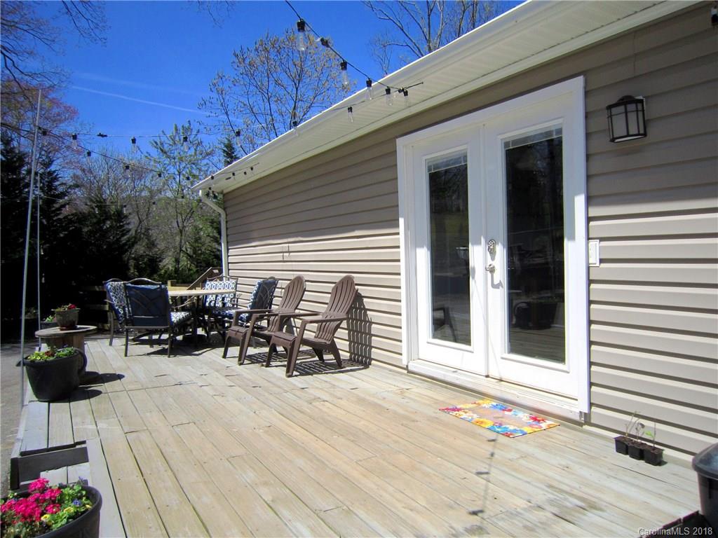 266 Murray Road Canton, NC 28716 - Photo 32 of 36 a view of a patio with a table and chairs and potted plants