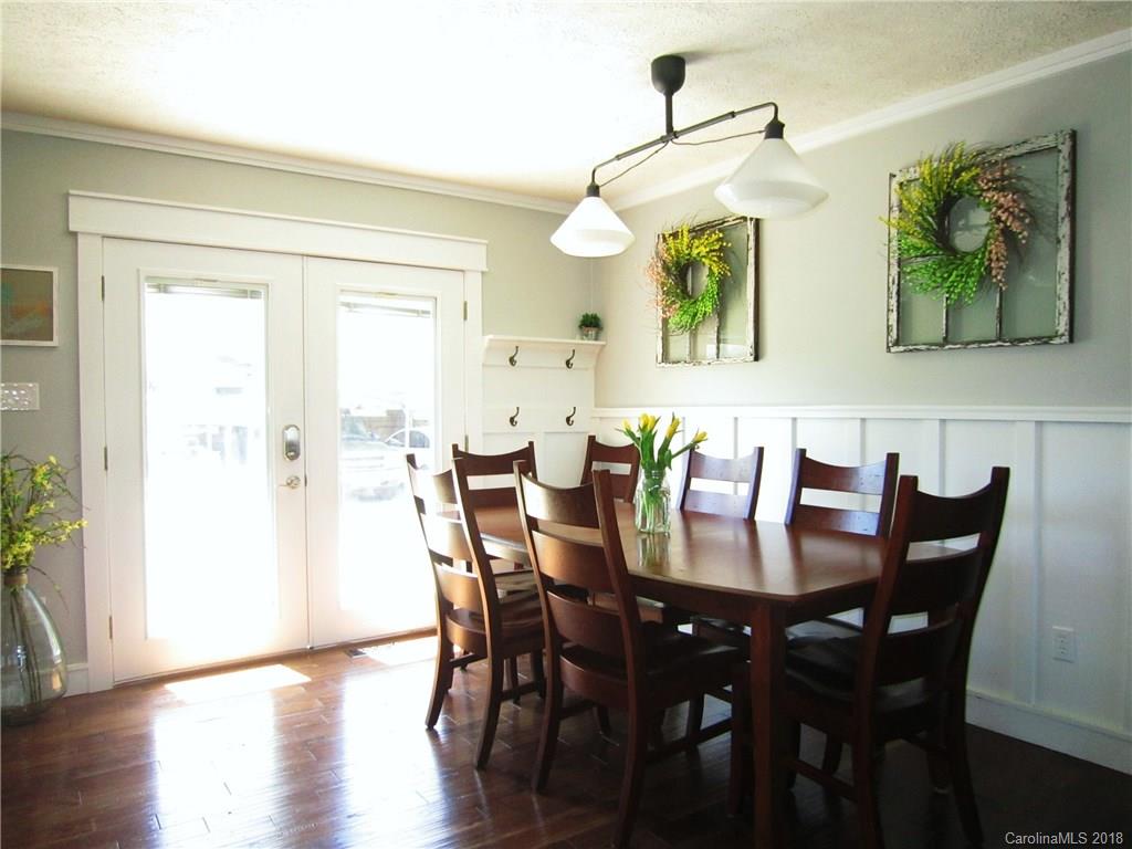 266 Murray Road Canton, NC 28716 - Photo 6 of 36 a view of a dining room with furniture and wooden floor