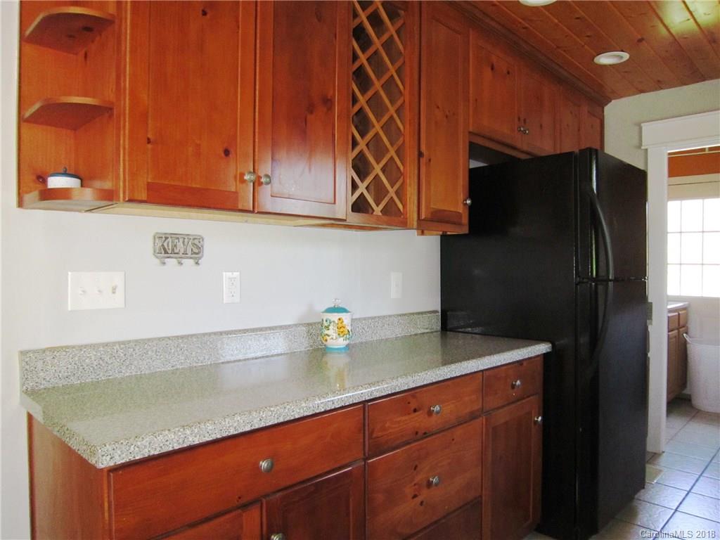 266 Murray Road Canton, NC 28716 - Photo 9 of 36 a kitchen with stainless steel appliances granite countertop a refrigerator and a sink