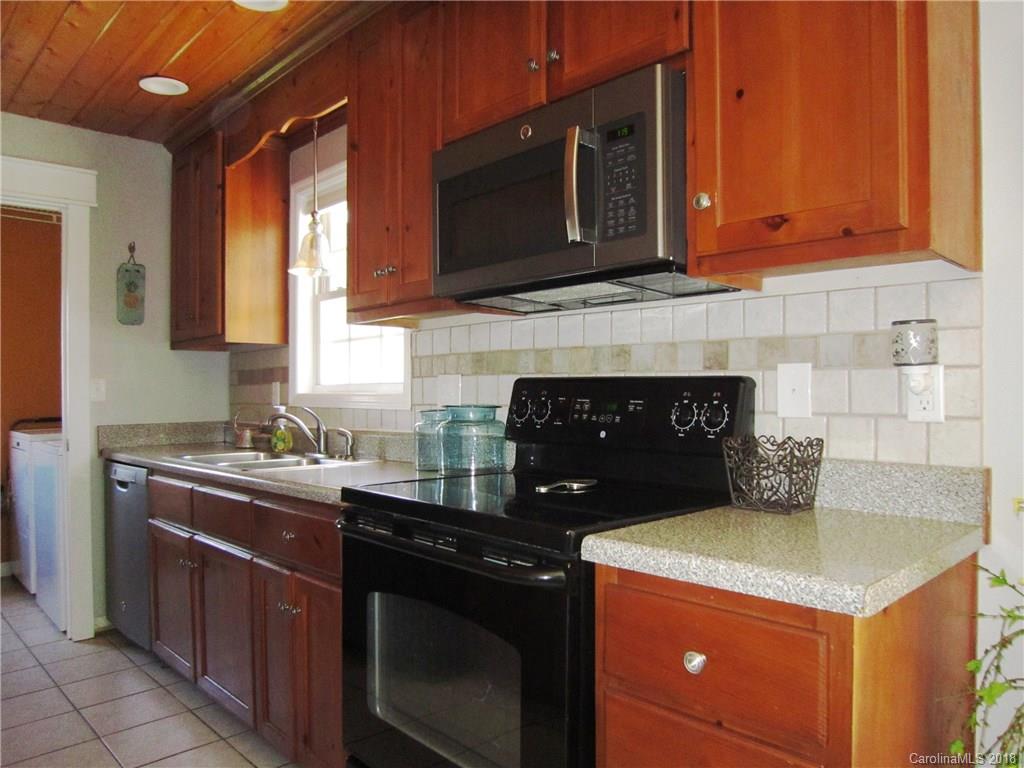 266 Murray Road Canton, NC 28716 - Photo 10 of 36 a kitchen with a sink stove and microwave