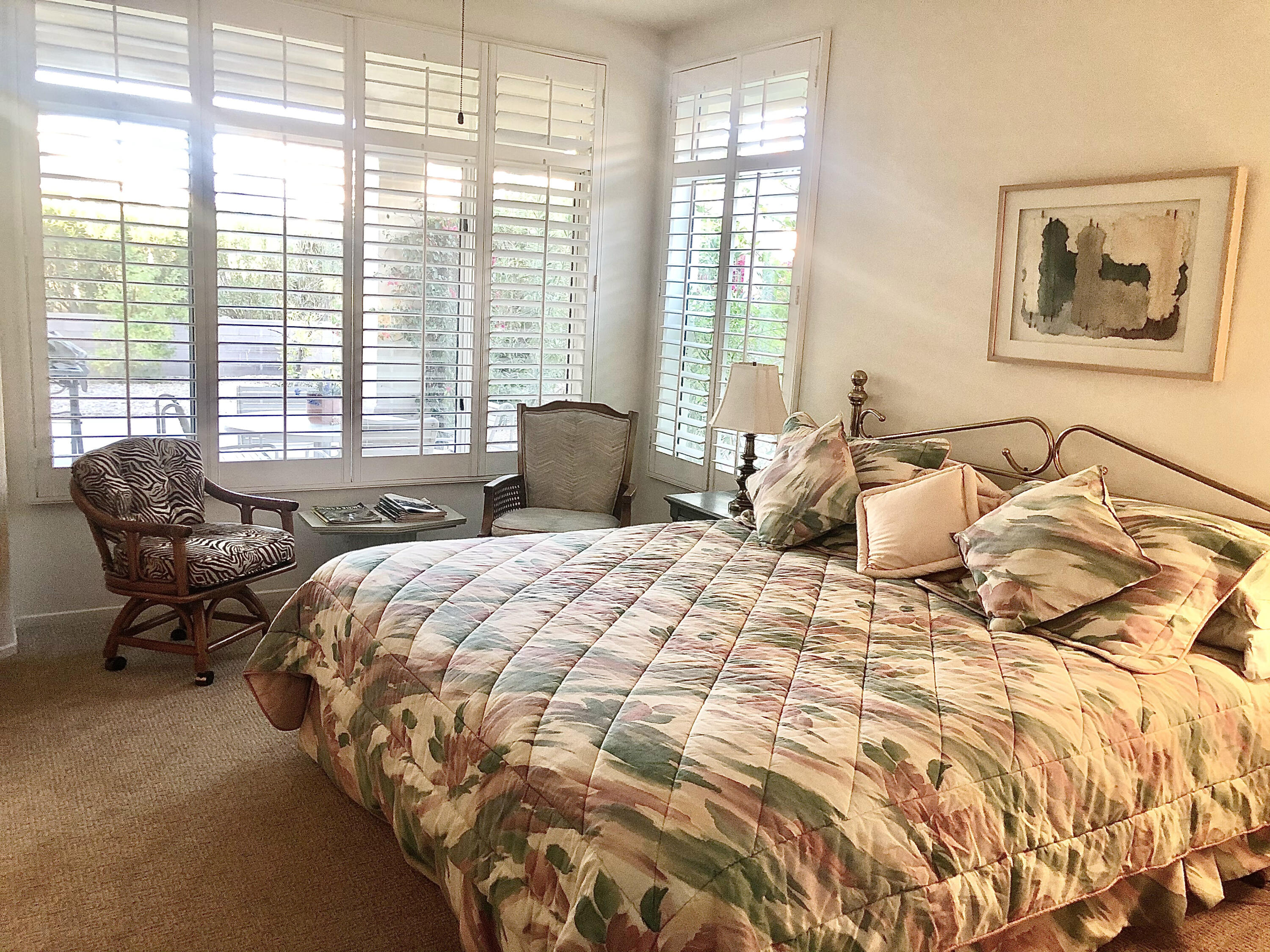 78366 Moongold Road Palm Desert, CA 92211 - Photo 11 of 17 a bedroom with bed and glass window