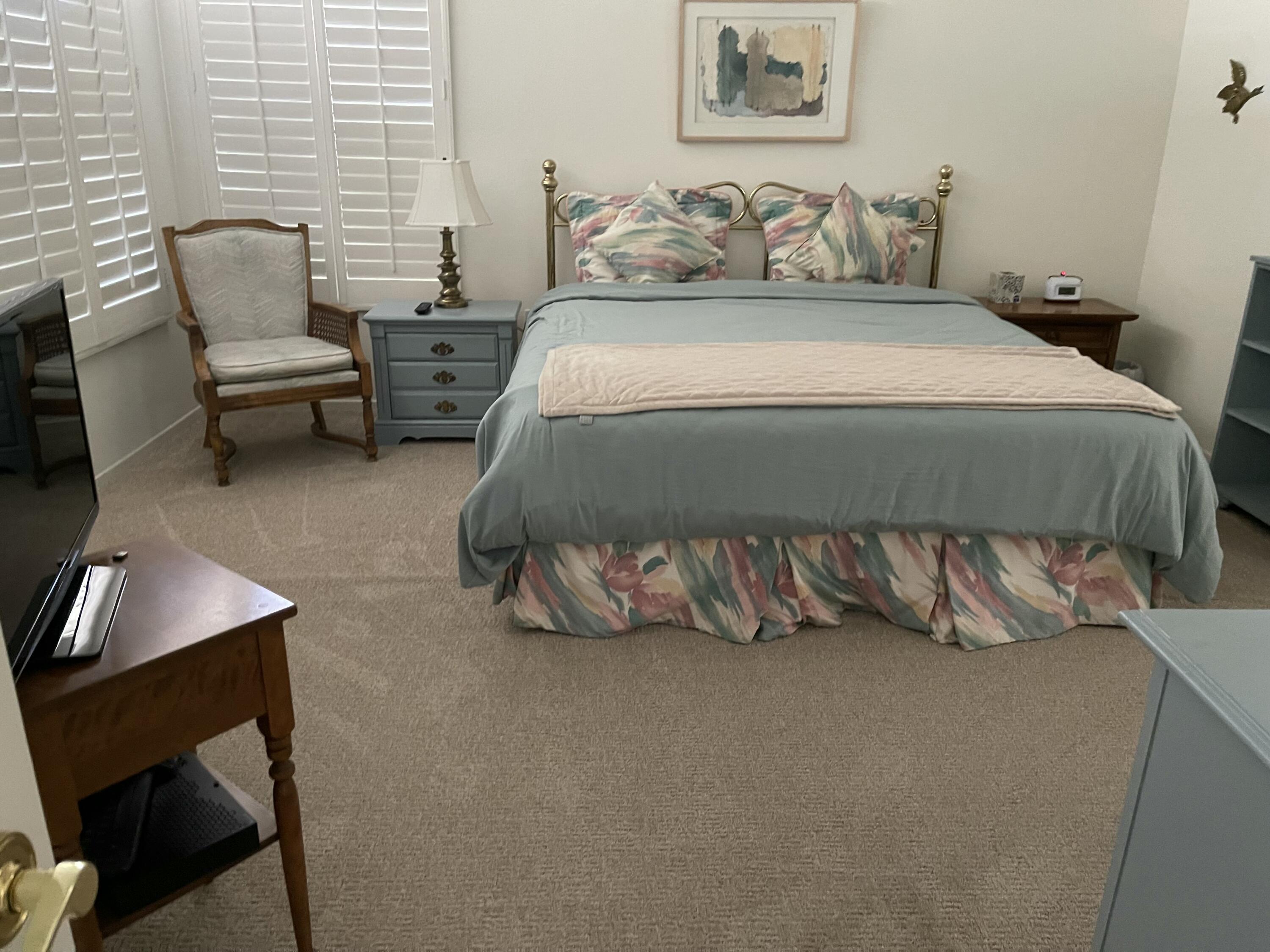 78366 Moongold Road Palm Desert, CA 92211 - Photo 12 of 17 a bedroom with a bed and a chair
