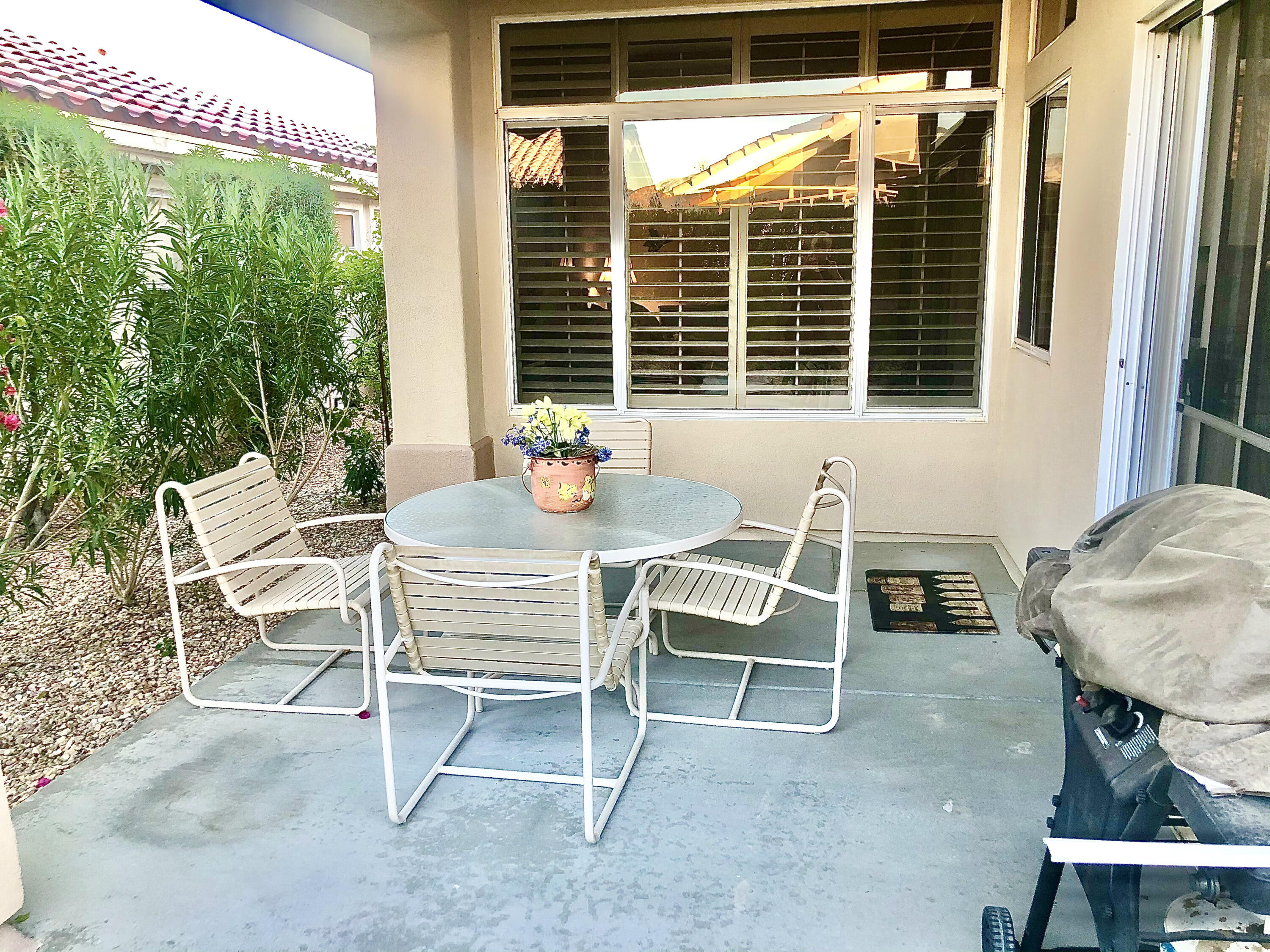 78366 Moongold Road Palm Desert, CA 92211 - Photo 15 of 17 a wooden bench sitting in front of a building