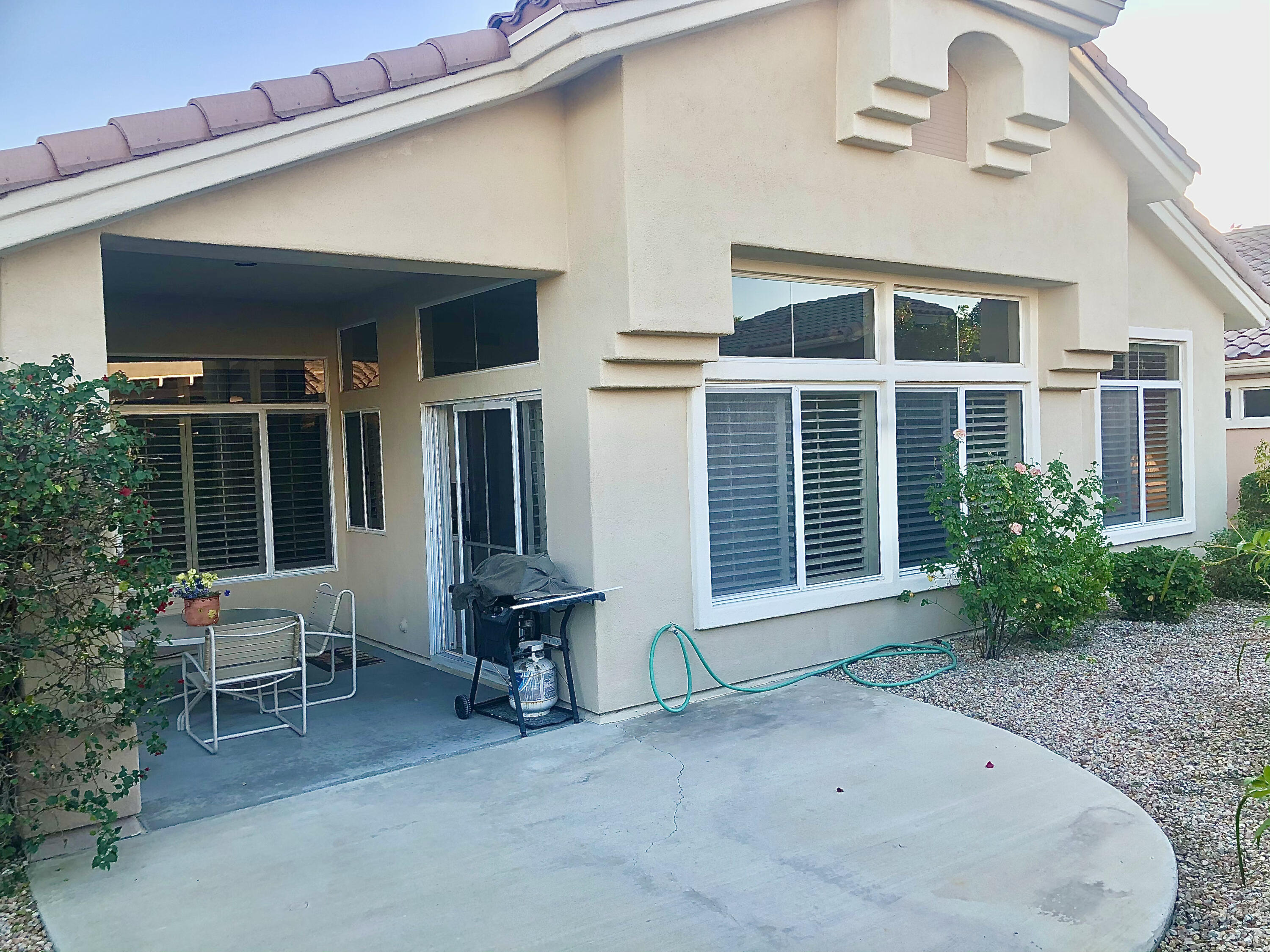 78366 Moongold Road Palm Desert, CA 92211 - Photo 16 of 17 a view of house with outdoor seating space and porch